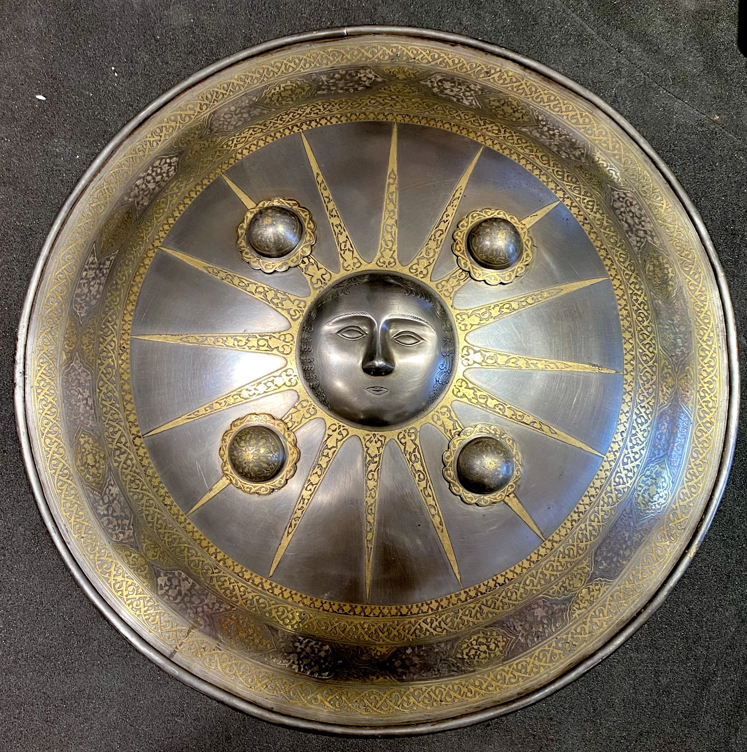 Shield with sun iconography