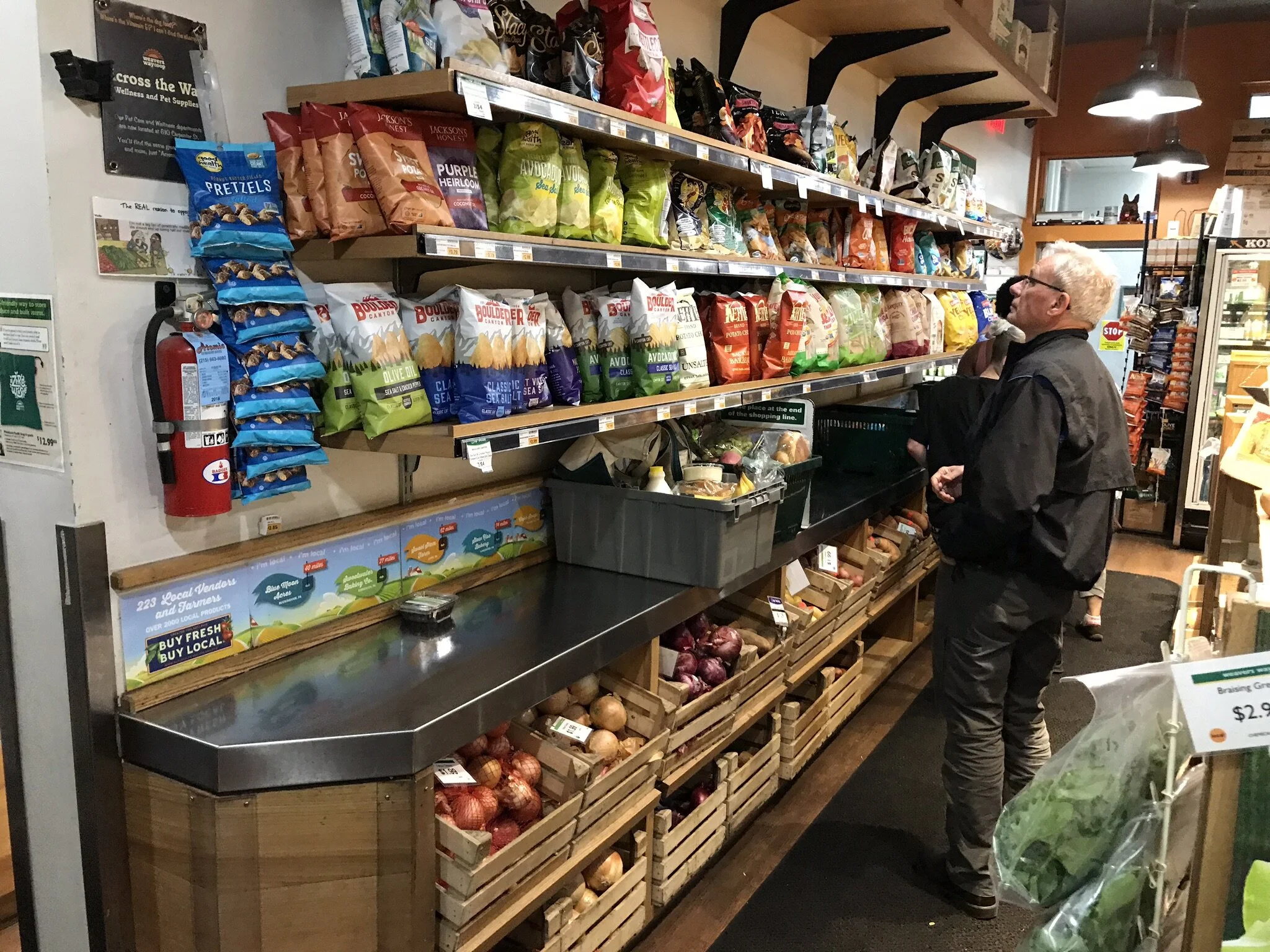 Tight space at Weavers Way Co-op in Mt. Airy. No room to even carry baskets around so shoppers park their baskets on the counter!