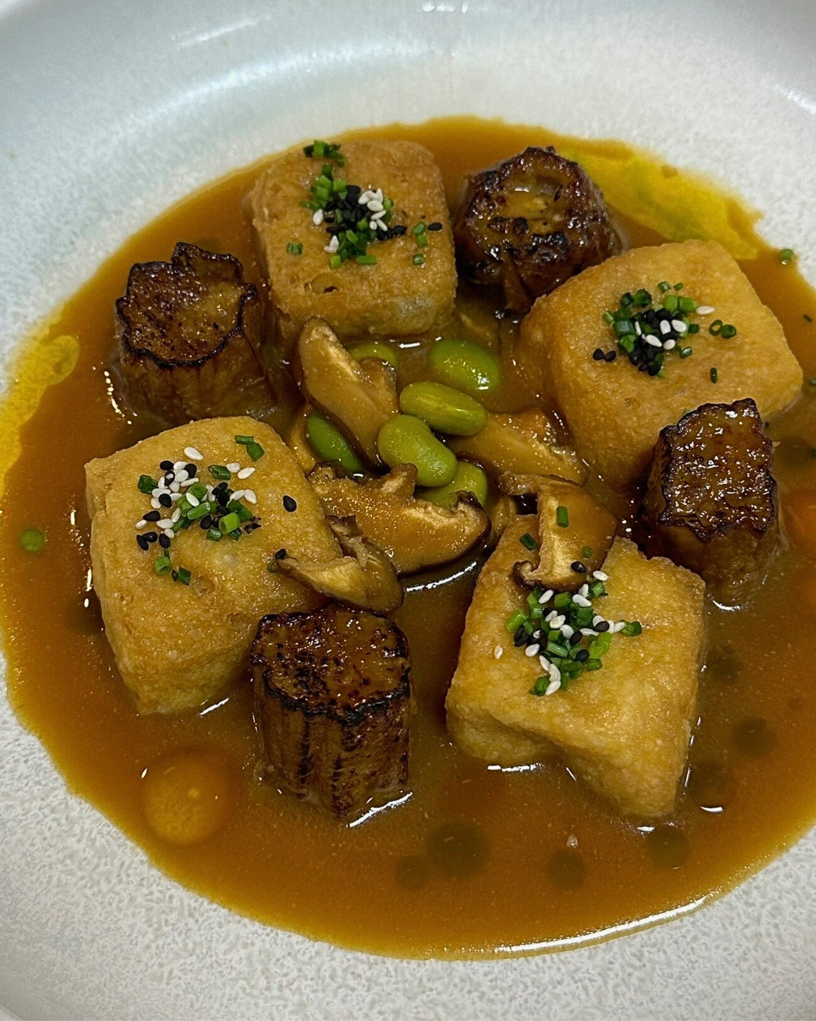 Depth. Balance. Warmth.

Miso eggplant with tofu, edamame, shiitake and sesame, finished in an aromatic umami broth. A refined share plate, crafted for the centre of the table.

Reserve your table through the link in our bio.
Open Wed - Sat 5:30pm ti