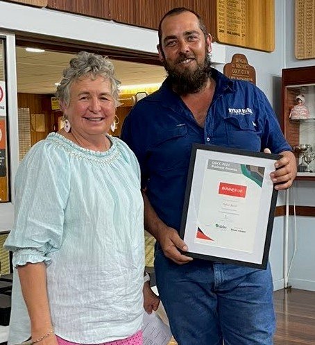 L to R Marion Stuart presenting for sponsors Lovey's IGA to Ryan Whyte from Rykar Rural.jpg