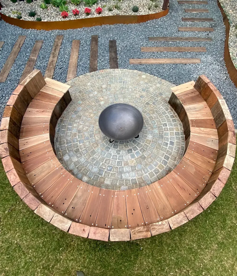 Railway Sleeper and Cobblestone Fire Pit by Green Sky Landscapes