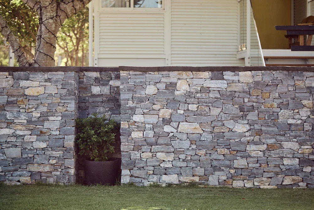 Hand-shaped stone wall detail, Suffolk Park