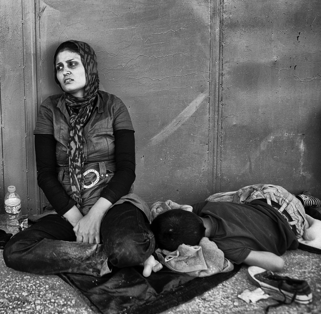  Nea Vyssa. (Greece) A woman and son take a rest in Nea Vyssa after cross the river Evros.  