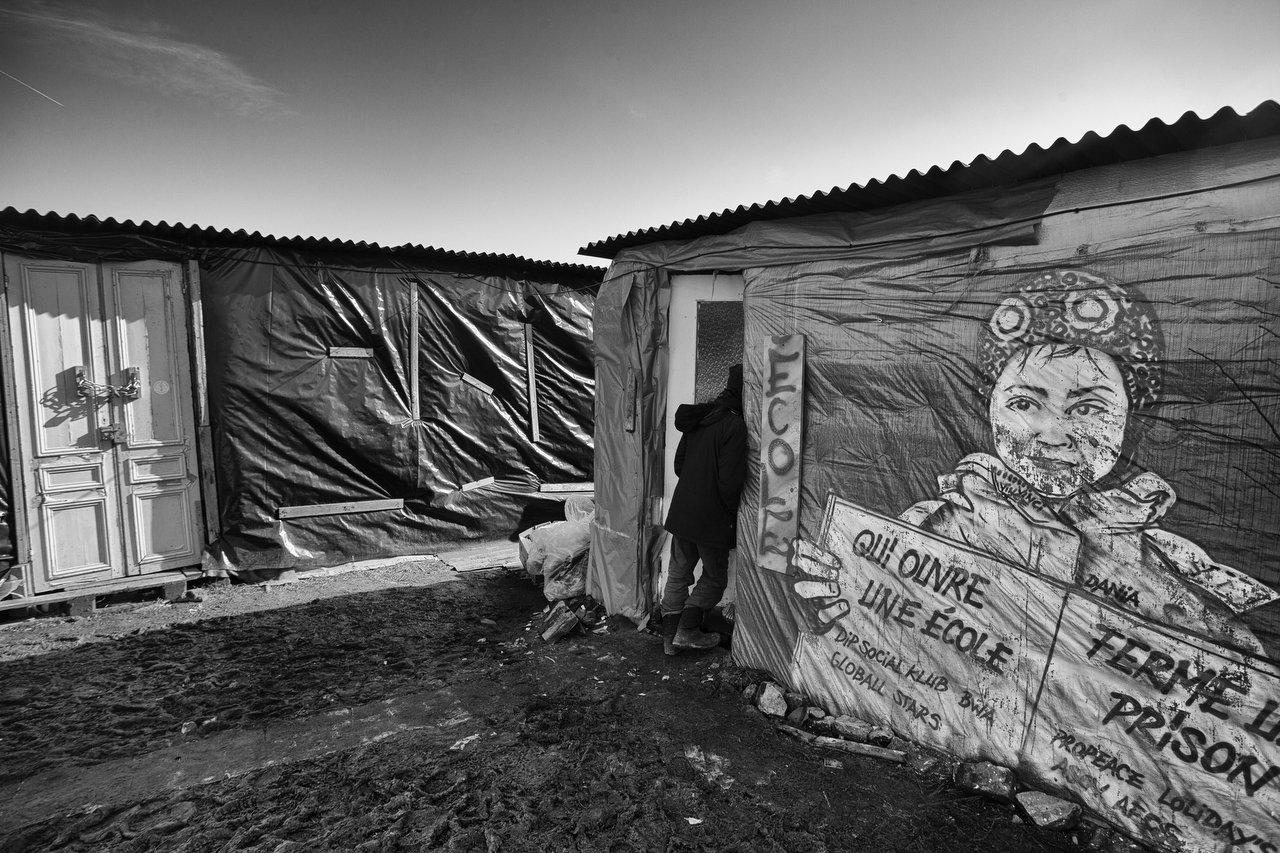  Last days for school of Jungle of Calais: will be demolished next days  Eritrean church & tents of 1K transmigrants, Calais, France, February 17, 2016. Credit Photo © Delmi Alvarez. 