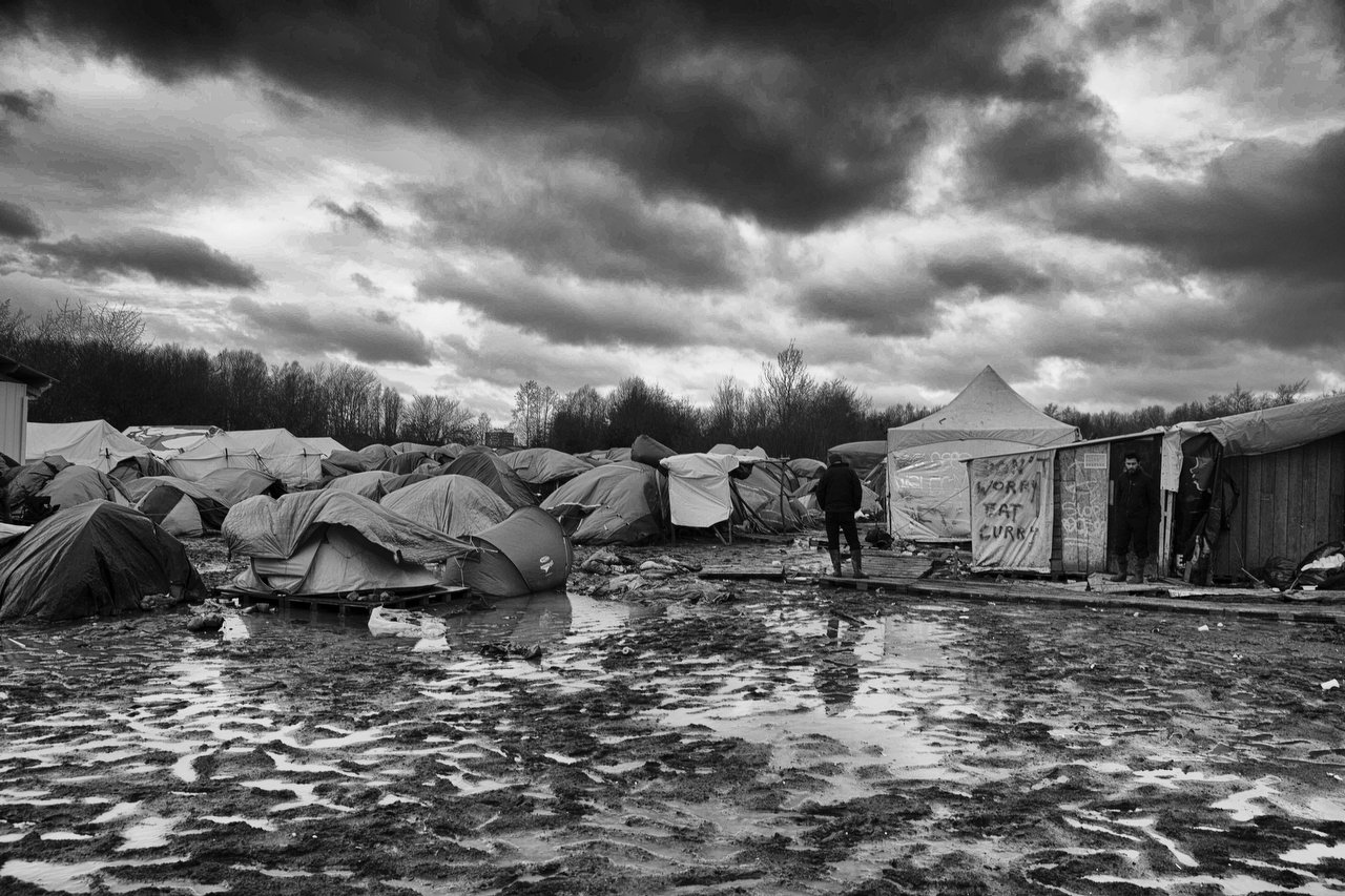  "Don't worry eat curry" said on a tent of a makeshift Scenes refugee camp of Grande-Synthe, Dunkirque, France, January 15, 2016. Photo Delmi Alvarez. 