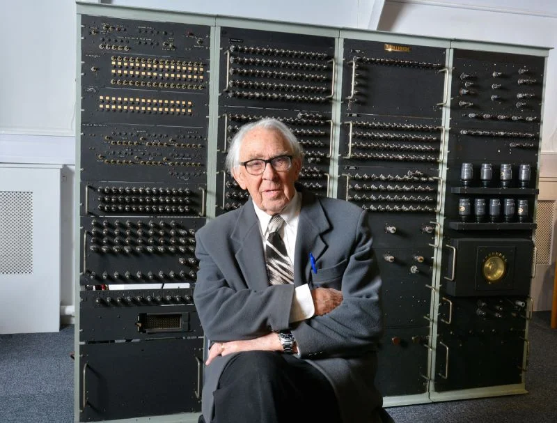 Dr Raymond Bird in front of the machine he engineered more than 60 years ago.