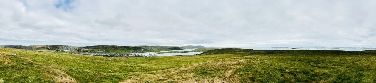 8th July 2018 DA FATEFUL TALE O MARION PARDONE This is the story of a Shetland witch. I first encountered Marion Pardone in October 2016 when Mum heard an interview about her on BBC Radio Shetland . I listened and was intrigued. This woman was executed in 1644 for capsizing a boat and drowning its passengers whilst disguised as a porpoise. How did this happen? My search for clues began at Shetland Archives . Brian Smith and Angus Johnson led me swiftly to trial papers. Here, in seventeenth century language, Marion’s misdeeds were detailed over ten pages. They described a Hillswick woman with an evil tongue who cursed those whom she wished ill. Her human and animal targets became victims of sickness, harm and death. She ‘took away the profit’ from produce by spoiling brewing and filling the udders of cows with blood and fetid water. Two ravens, agents of the devil, were seen accompanying her on a three quarter mile walk. Marion failed to learn The Lord’s Prayer or say it in her lifetime. Her fateful act, though, was consorting with another witch to drown a fishing boat’s passengers one fair Hillswick morning in a safe spot by the shore. Marion and her husband, Swene, were brought to see two of the boat’s corpses and lay their hands on them days after death, when ‘ all their blood was vanished and dissolved from any natural course ’. One bled at the collar bone whilst blood gushed from the hands and fingers of the other ‘ to the great admiration of the beholders, and revelation of the judgement of the almighty .’ Marion was, by this proof, brought to judgement, convicted and condemned. She was taken to the west hill of Berrie in Scalloway (pictured at the top of this blog post), strangled and burned in ashes. In December 2017 the Shetland Archives team directed me towards Samuel Hibbert’s A Description of the Shetland Islands (1822) for further information on Marion Pardone and witchcraft more generally. In this book I was interested to read that ‘ It was usual with the Shetland dealers in sorcery, like the ancient magicians of Scandinavia, to use incantations.’ Hibbert gives this example: About fifty years ago, a woman, of the parish of Dunrossness, known to have a deadly enmity against a boat's crew that had set off for the Haaf, took a wooden bason, named a cap, and allowed it to float on the surface of a tub of water; then, to avoid exciting a suspicion of her devilry, she went on with her usual domestic labours, and, as if to lighten the burden of them, sang an old Norse ditty. After a verse or two had been recited, she sent a child to the tub, and bade him tell her if the cap was whummilled, or turned upside down. Her orders were obeyed, and intelligence were soon brought to her, that the water was beginning to be agitated, but that the bowl was afloat. She then continued her incantation, and once more broke it off, by requesting the child to go again to the tub, and let her know if the cap was whummilled. The little messenger soon returned with the news that there was a strange swell in the water, which caused the bowl to be sadly tossed about. The witch then sang still more loudly, and, for the third time, sent the child to the tub to report the state of the bason, who immediately hastened back with the information that the water was frightfully troubled, and that the cap was whummilled. The enchantress, with an air of malignant satisfaction, then ceased her song, and said, “The Turn is done.” On the same day, news came that a fishing yaul had been lost in the Roust, and that the whole of the crew had been drowned. Given the historic link between witchcraft and music, a song telling Marion’s story felt necessary, and the difficult process of selecting an angle began. In the trial papers I was struck by a recurring phrase amongst the witchcraft claims, namely ‘ which you cannot deny .’ This statement appeared at the end of eight indictments against Marion. It seemed appropriate that my song’s lyrics be written from the perspective of community members, those who furnished this trial with accepted evidence of the day. To return to the beginning, to that Radio Shetland interview, the reporter (Daniel Lawson) asked local historian, John Shaw, what was going on; was this a case of nasty neighbours? John replied that three things are needed for such a situation to arise. Firstly, neighbourhood disputes are required. Whether Marion was a difficult neighbour or whether others were picking on her is difficult to determine. Secondly, a state is needed which is willing to prosecute the case, and in this case the state executes. Thirdly, an ideology is needed to provide an intellectual and moral framework. In this case, there was a widespread and growing belief in the Devil as an agent in the world using witches as conspirators to destroy God’s order on earth. I’ll leave you with your own thoughts on this story. You can listen to a rough recording of the song here . Below is a photo of a black cat which crossed my path as I drove to the site of Marion’s execution today. Da Fateful Tale o Marion Pardone Du felled neebour fock wi seekness Wir baess dey lost der life A ston du lowsed aneath a man Dan saved him for his wife Du took awa da profit Fae bear an milk an kye Udders filled wi blöd an water Göd malt wis marred forby Da curses rain, da charges fly Dat you, rank witch, cannot deny Da curses rain, da charges fly Dat you, rank witch, cannot deny Du cast madness on dy servant Becis shö widna bide She drew blöd fae your twa fingers An eence again cam richt Du killed able working horses Kept corbie company Consortit wi anidder witch Shunned God fir aa to see CHORUS Dy taste for wicked witchcraft At last sealed dy demise Fir a fishing boat du capsized A neesick dy disguise Du droondit four aboard her Ee flat calm Hillsook day Dy man an dee wis brocht ta see Der wis a price ta pay CHORUS Dy haands wis placed on twa dry crangs A craig-bane bled ageen Fae anidder’s finger blöd gushed Göd’s judgement it wis seen Dy guilt wis worthy o dy death In 1644 Apo da Berrie wast hill Du wis strangled dat voar CHORUS Dy burnin freed wis o dy curse Dy evil tongue an eye Göd’s justice done, da Deil slain Nae mair sal du deny