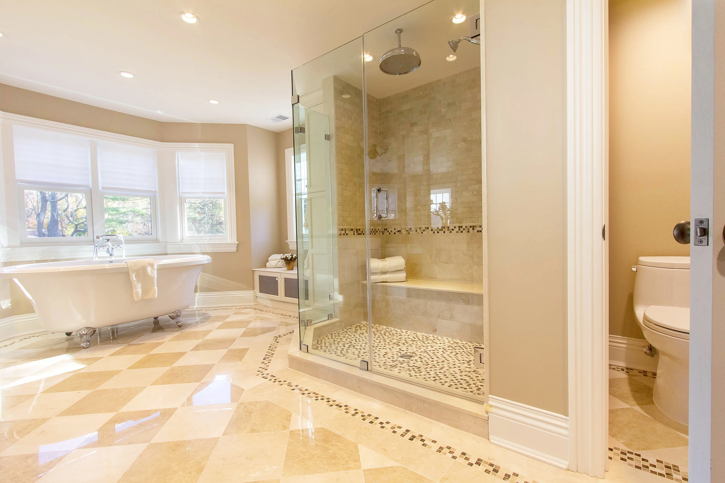 Large bathroom with golden hues throughout