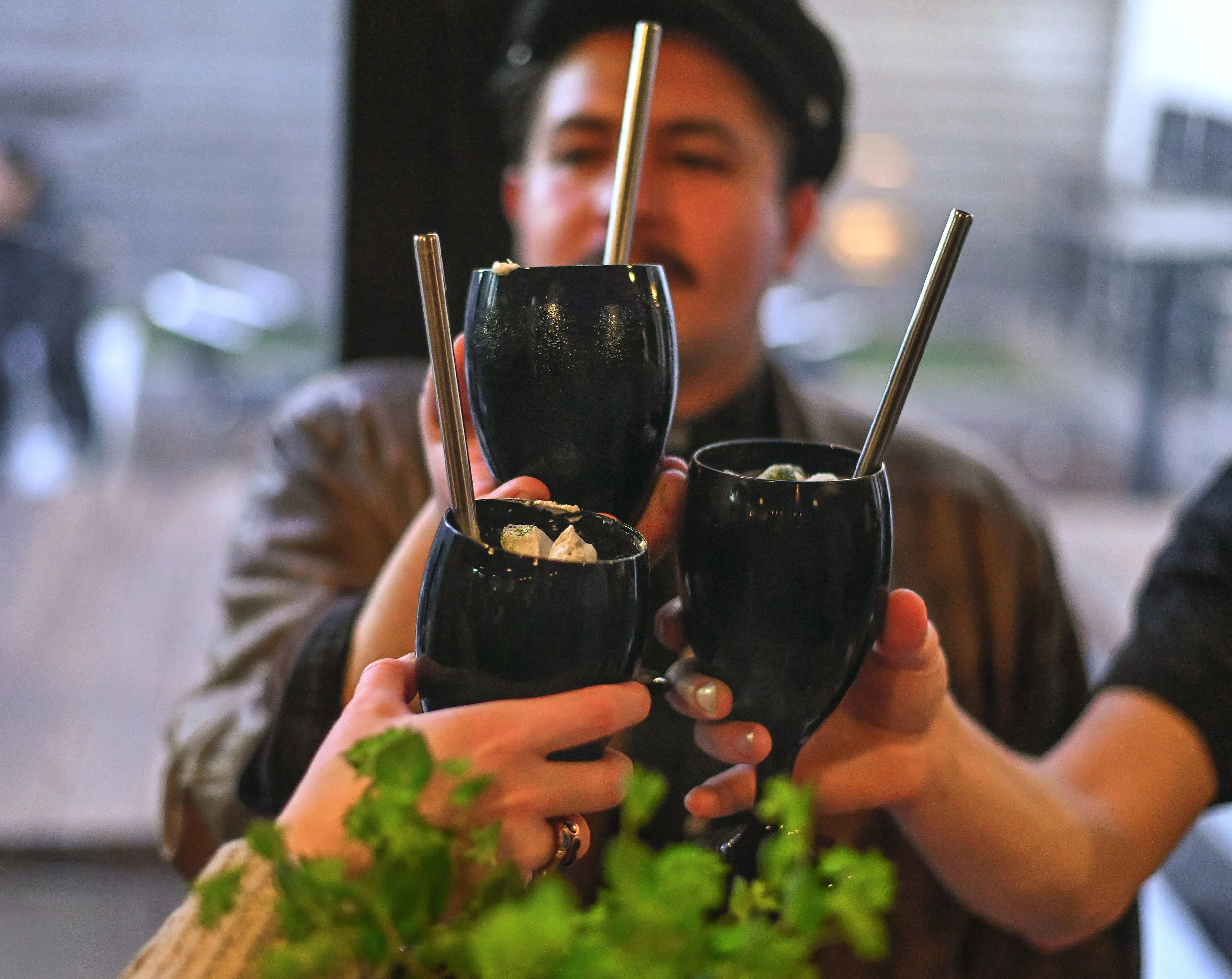 Chloe Lindstrom and her coworkers from S.K.Y cheers with their version of an Irish coffee cocktail.