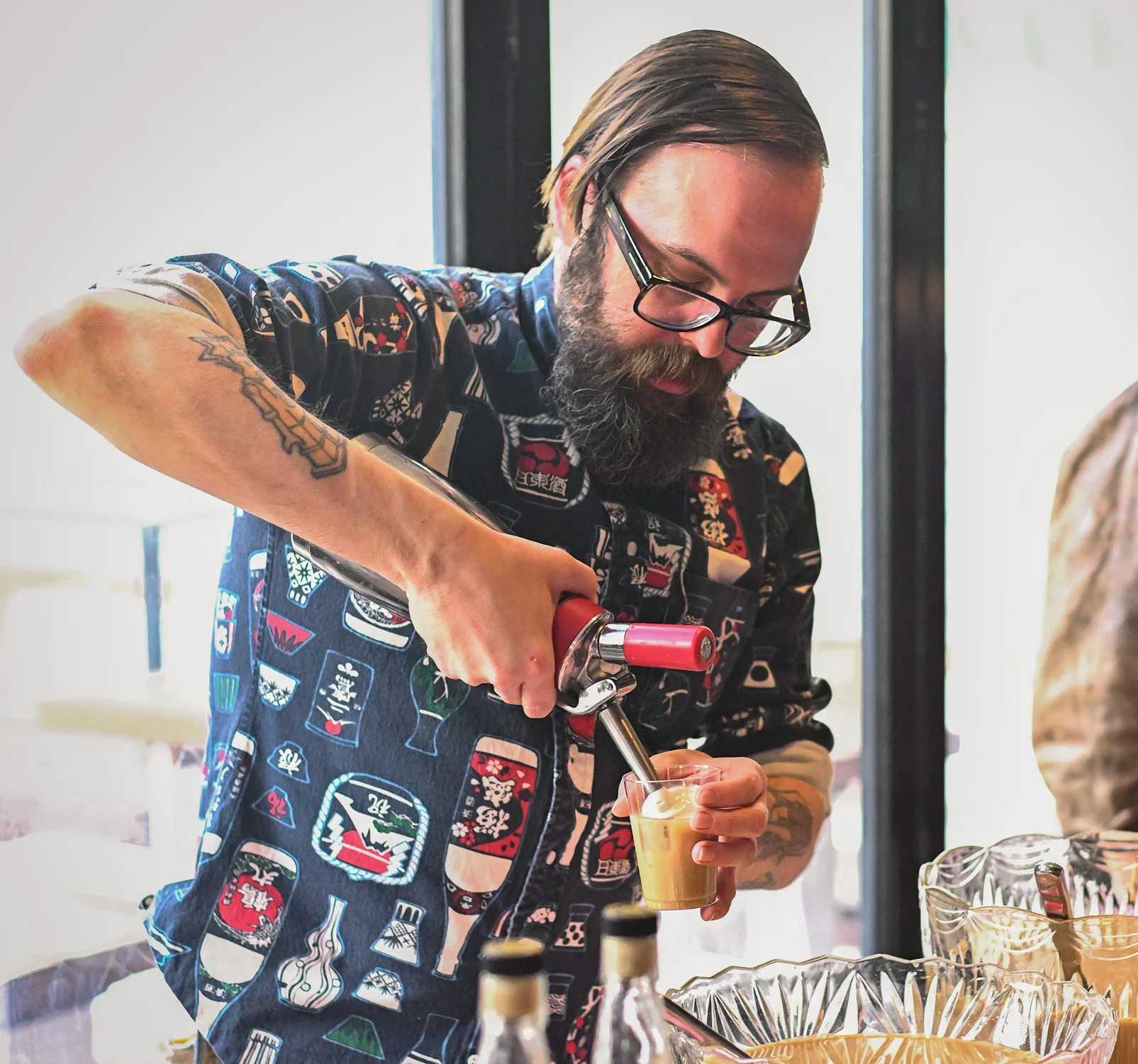Aaron Minnes of Punch House tops his Irish coffee cocktail with whipped cream.