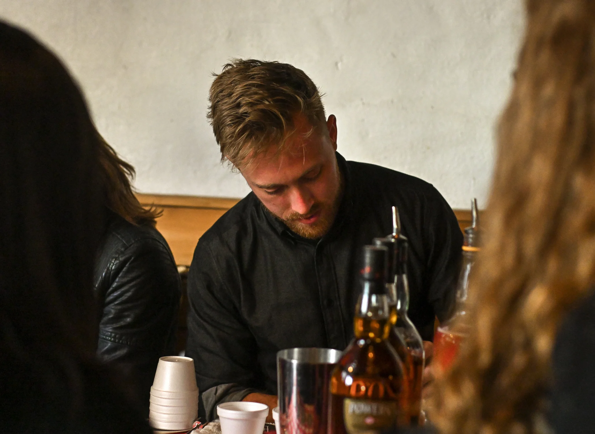Tait Forman of Bibo Ergo Sum prepares cocktails for guests.