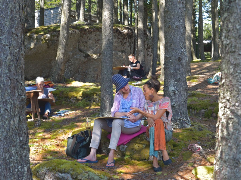 Students paint in the woods at Haystack Mountain School of Crafts