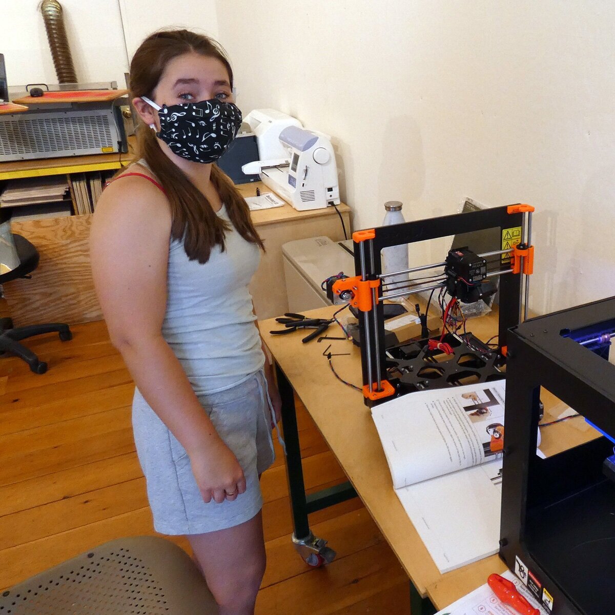 McHenna building a 3D printer to increase production. 