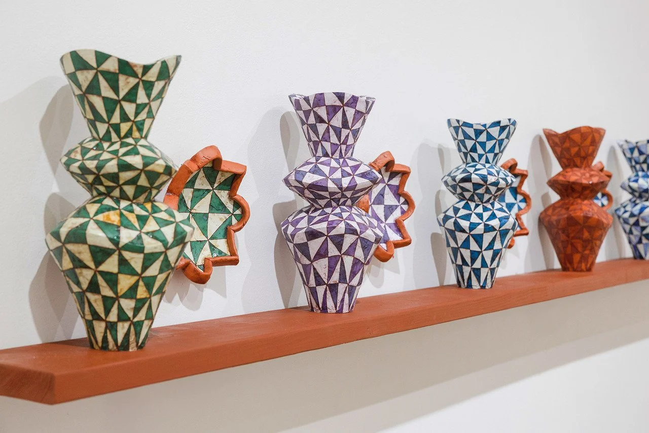   In Common / In Contrast,  Jaden Estes Carlson, 2025; terra cotta, terra sigillata, underglaze, glaze; 15 in. x 7 in. x 7 in. (vessels); 8 in. x 8 in. x 2.5 in. (wall-hanging). 