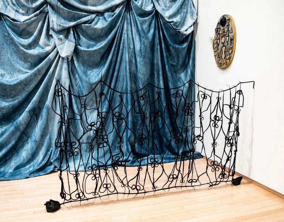   Sankofa Hair Gate  (Installation), Angelique Scott, 2025; hair, black glass; 5 ft. x 2 ft. 