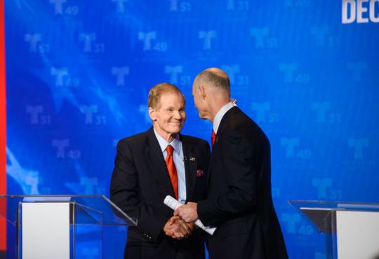 Sen. Bill Nelson and Gov. Rick Scott shake hands at the first Senate debate in Miramar, FL on Tuesday. (Photo: Ivan Apfel for NBCUniversal/Telemundo)