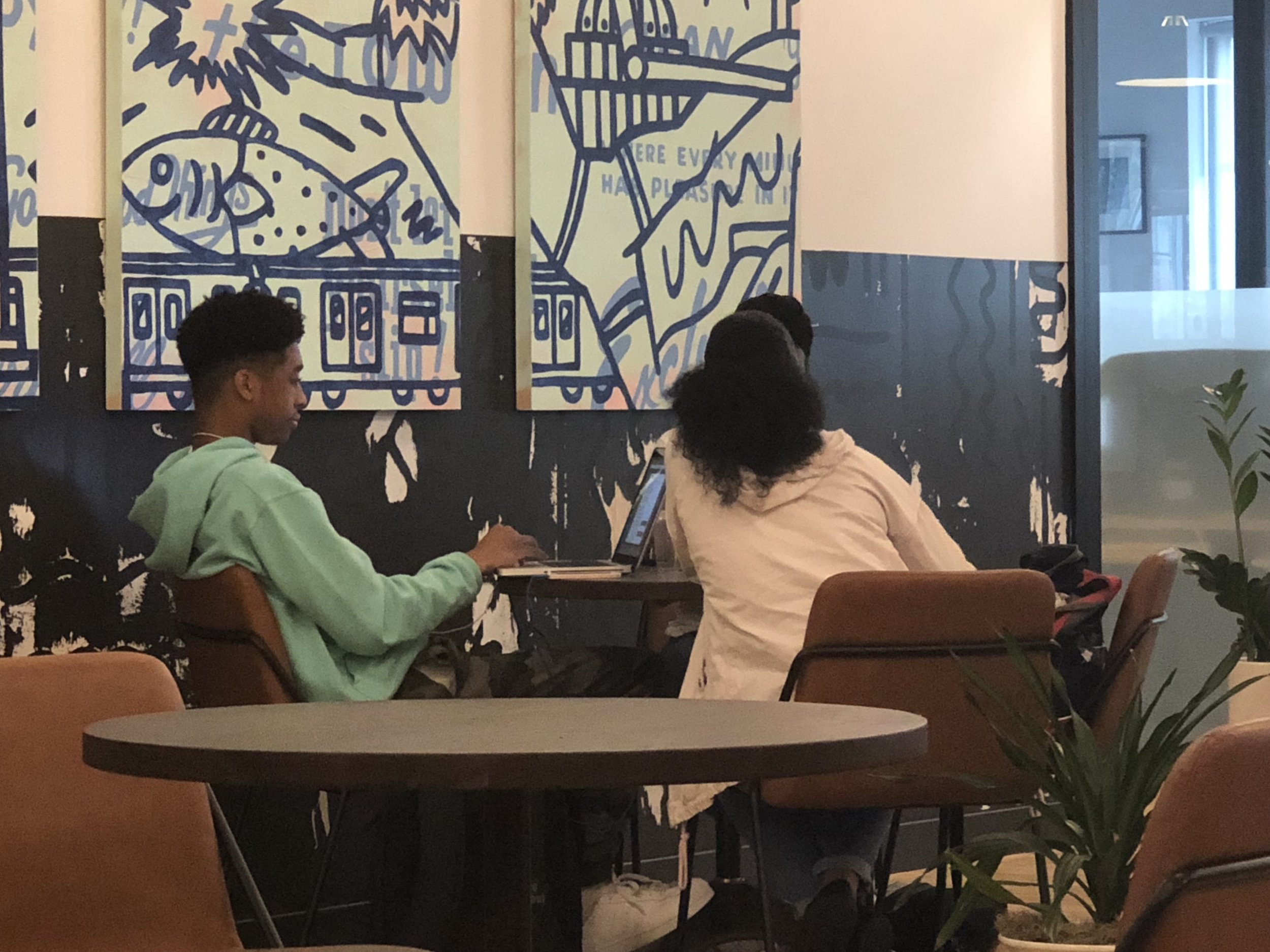 Our Youth Strategists, Brandon Alston and Kayla Boodoo building a project schedule for Technology for Children Africa in WeWork. 