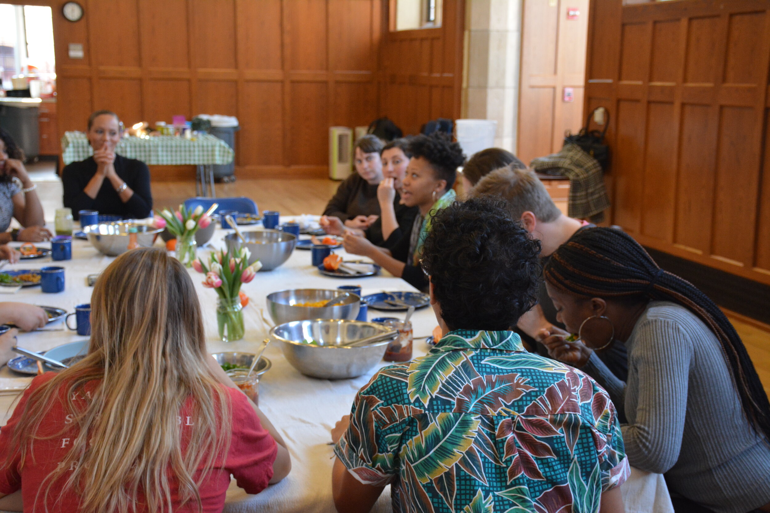  Students, staff, and community members enjoy conversation together at lunch with Kiki.  