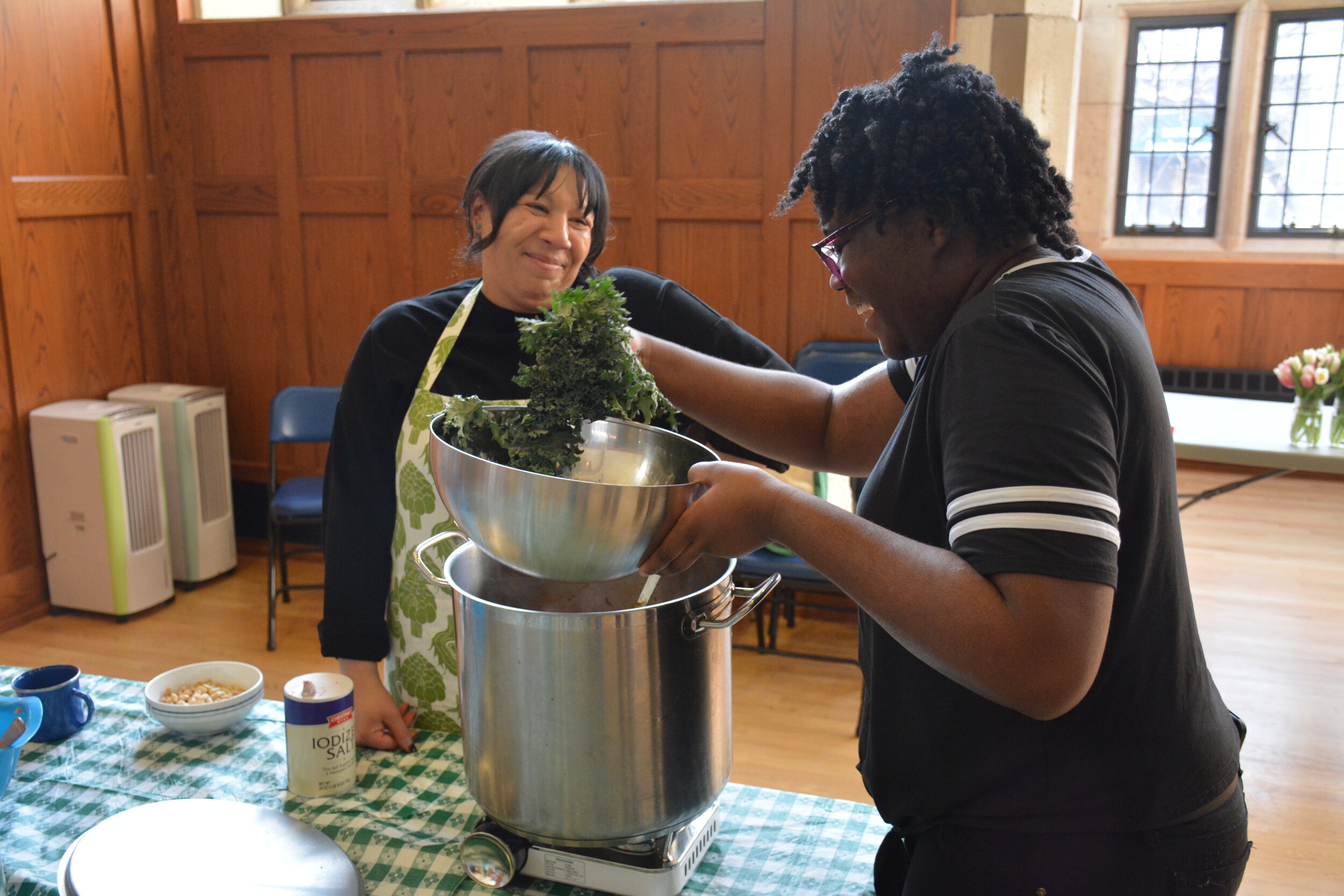  Adding local Massaro Farm kale to finish off our peanut stew!  