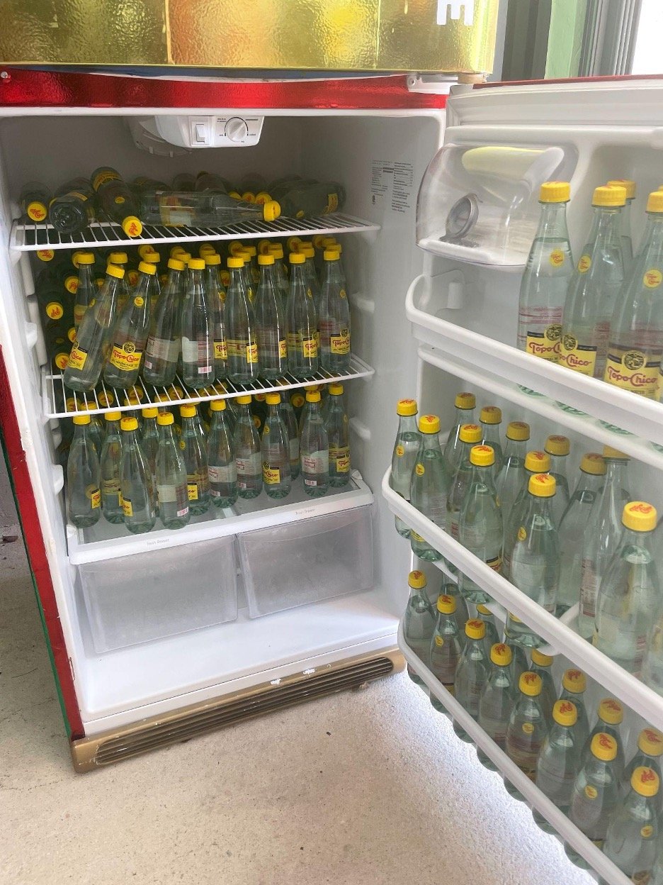  A community fridge in Hialeah stocked with donated water that I stocked, organized, and cleaned during my volunteer work with Buddy System and Food Rescue.&nbsp; 
