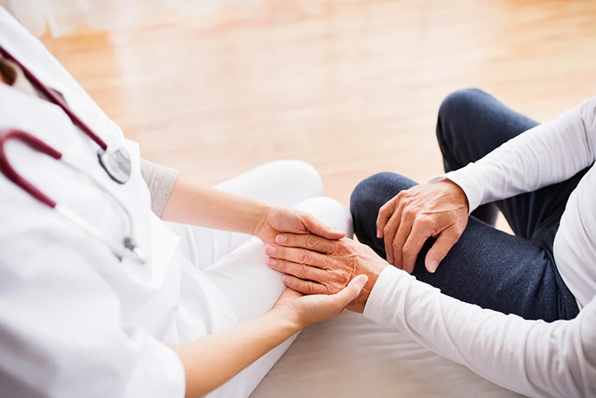 Health-visitor-and-a-senior-man-during-home-visit.-876523384_web.jpg