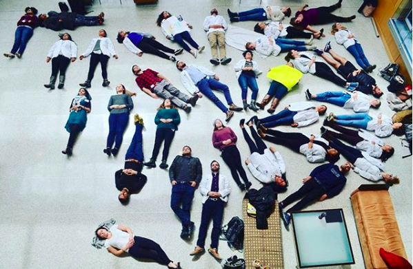 UMASS Medical School classmates and I in the main lobby participating in the White Coats for Black Lives National Die-In to protest police shootings of black Americans (April 2018).