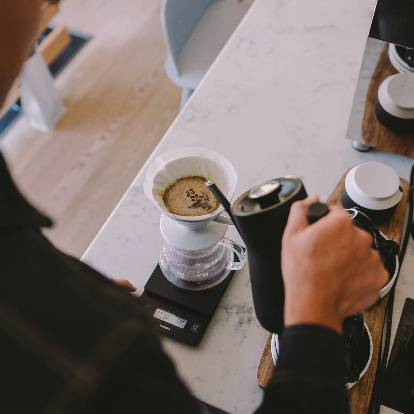 Pouring water in concentric motions aids brewing.