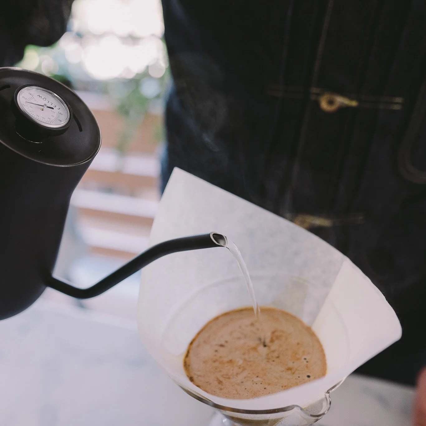 Adding coffee to V60 2 cup.