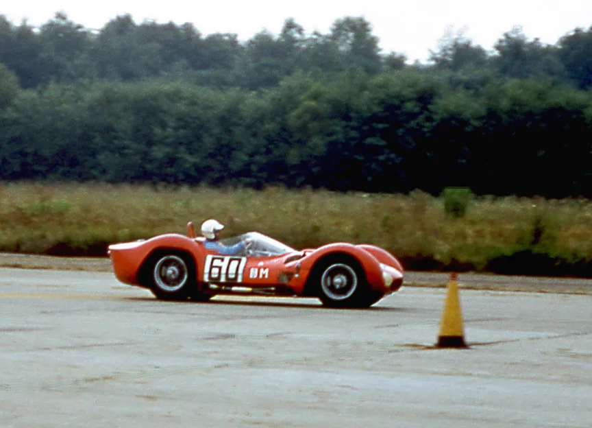 Walt Hansgen in a red Maserati Birdcage Tipo 61. The Cunningham white with blue stripes sadly missing.