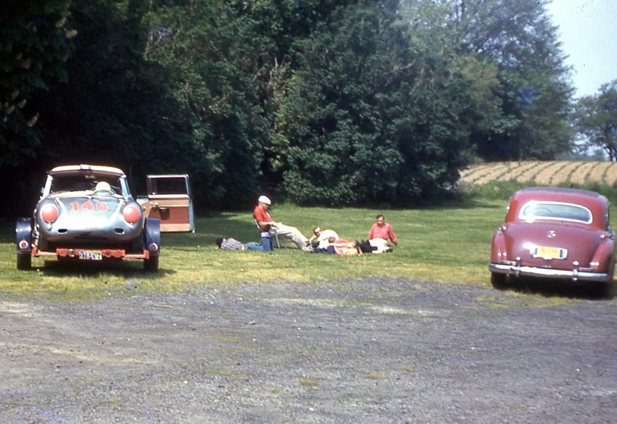 The Holbert family relaxes at the Maidstone hotel lot. A field of those famous Long Island potatoes in back.