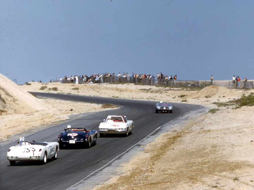Bucher’s Porsche leads Kerr’s Corvette, Bob Mouat’s well known black #57 and Bob Johnson in #33.