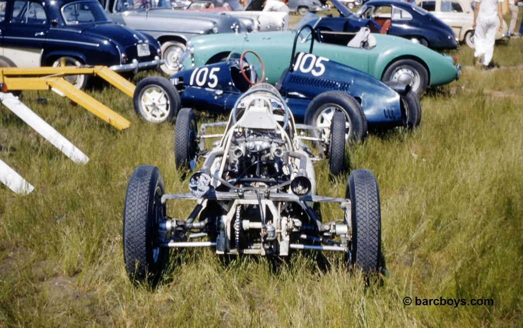 A Formula III sitting in the grass naked, a brother #105 and a brand new MGA waiting for its proud owner.
