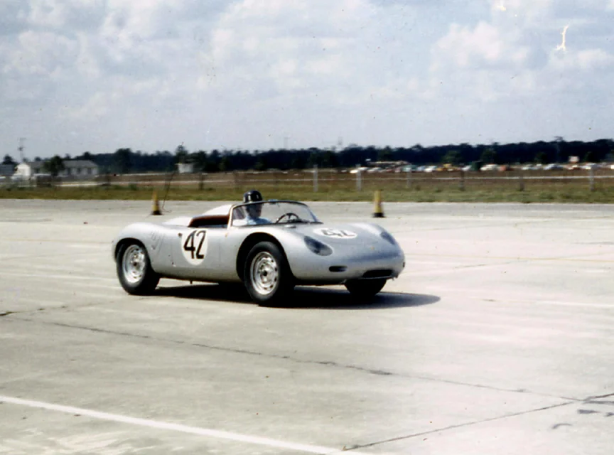 Graham Hill in the #42 RS-60. Hill and Bonnier chose not to drive the car in the rac and Gendebien & Hermann took it and won.