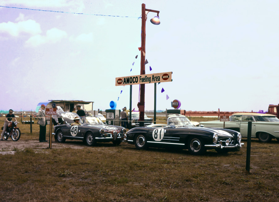 Late in the day Cameron and Jeanne Argetsinger fuel their Alfa Giulietta. The #81 300SL practiced but ran out of brakes and no spares were available. The car never started, Argetsinger and Bill Milliken finished 27th overall and 4th in GT 1.3.