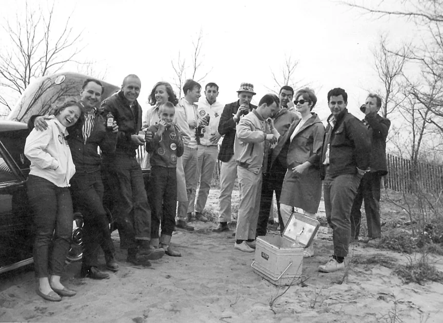 Jack Deren hugs Judy, Decker smiles with his son and wife Joan, Gordy Ruston, Roy Bishara, Dave Zych. Alan and Phyllis in the center and Nicholas shows his IQ in back.