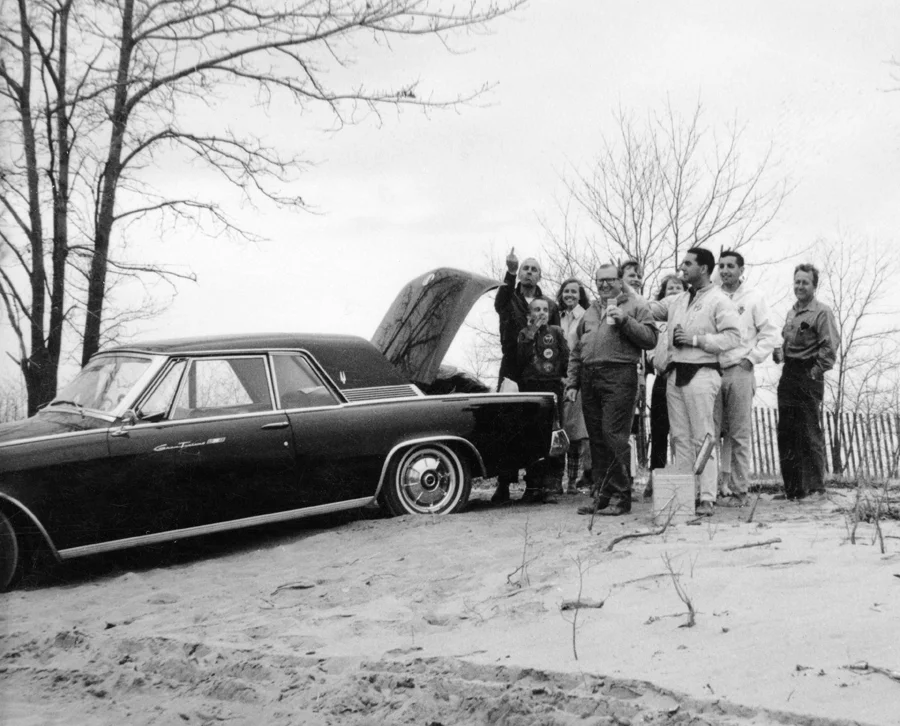 The BARC gathers around Spankey Smith’s Studebaker Golden Hawk. The weather is chilly, no leaves on the trees but where there is the BARC there is always some chilly beers