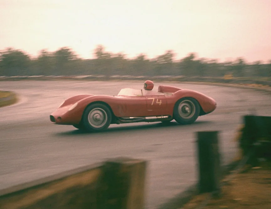 Charlie Kolb in this Maserati 200 jumping over the oval where the road course crossed to the infield.