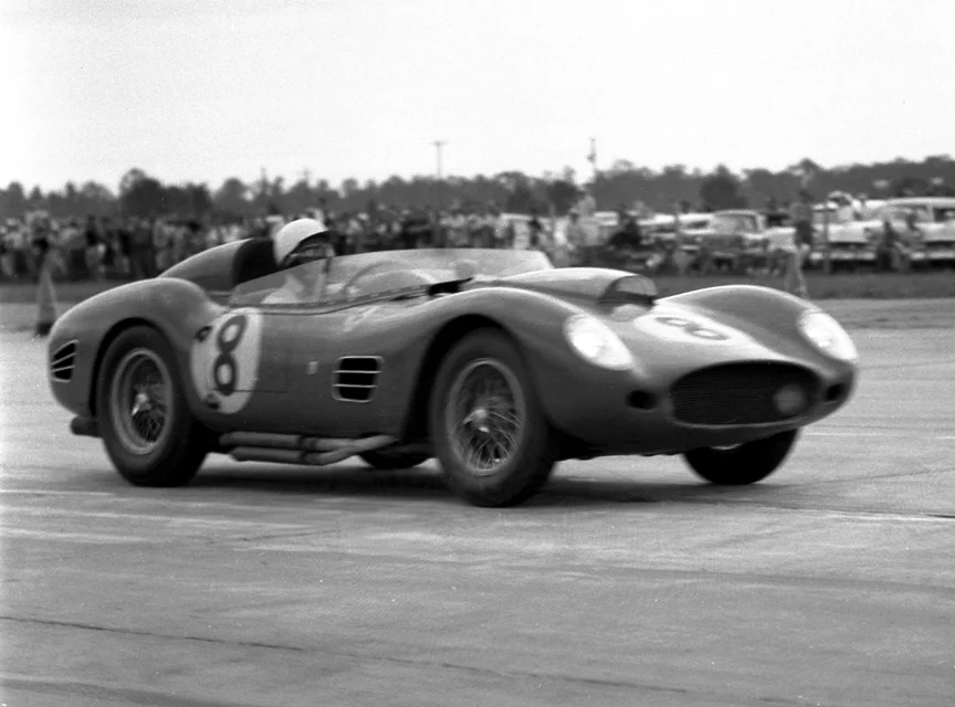 Just after the start Gendebien handles the #8 Ferrari TR 59/60. I love the side pipes carrying the V12 sounds to the crowd.