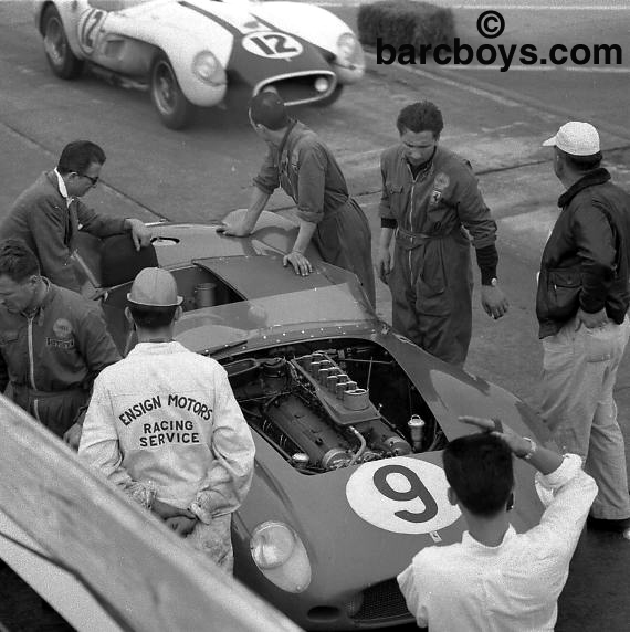 Practice day from above the pits. The #9 Ferrari of Jean Behra and Cliff Allison is looked after as the pontoon Testa Rossa of E.D. Martin and Lance Reventlow goes past.