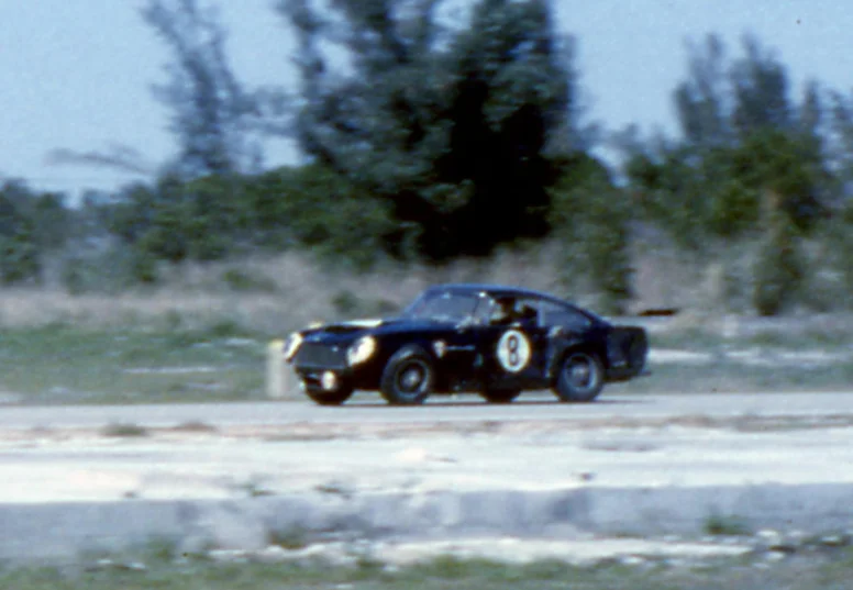 Look carefully. The LF wheel is leaning over badly. The hub has failed and this is the last lap for the big Aston.