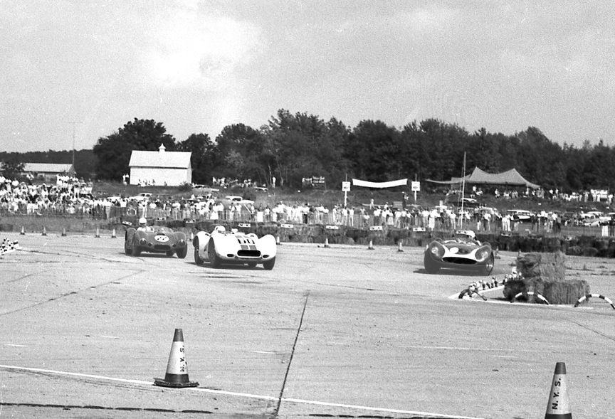While Daigh and Crawford are beating on each other Walt Hansgen, Lance Reventlow and Bill Sadler are fighting at the front. Here Reventlow slides off the track at the chicane leading to the start finish line.