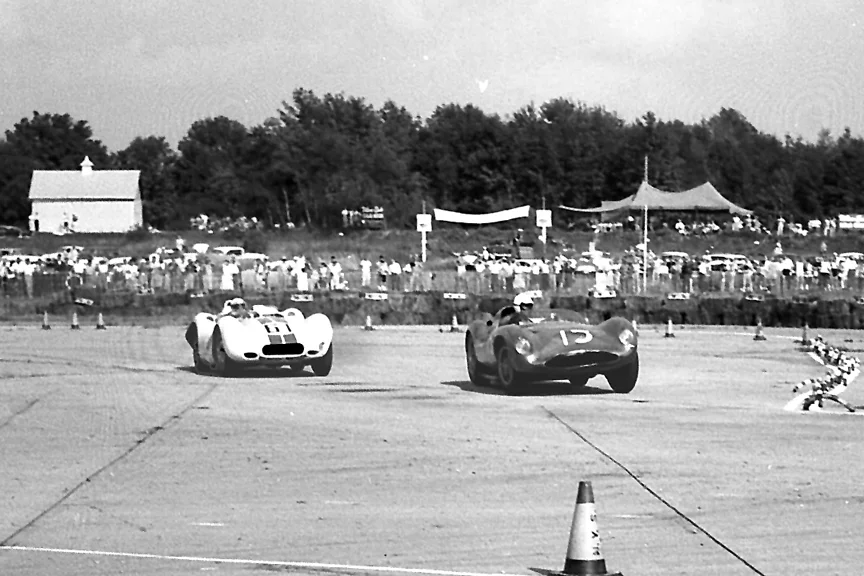 Chuck Daigh is now ahead of Ed Crawford but you can see the RR of the Lister is bent as is the front of the Scarab. All the “gentlemans” racing was tossed out for this epic battle.
