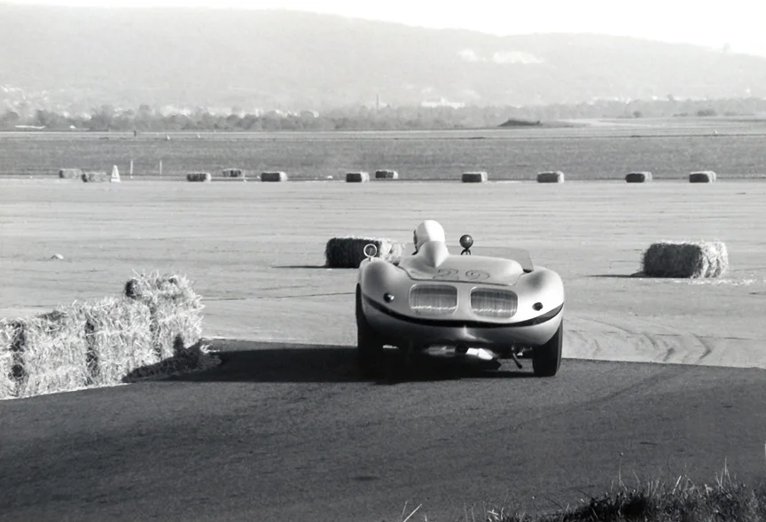 Bob Bucher's Porsche RS-60 comes off the road onto the runways of the Reading Airport. Bucher won easily.