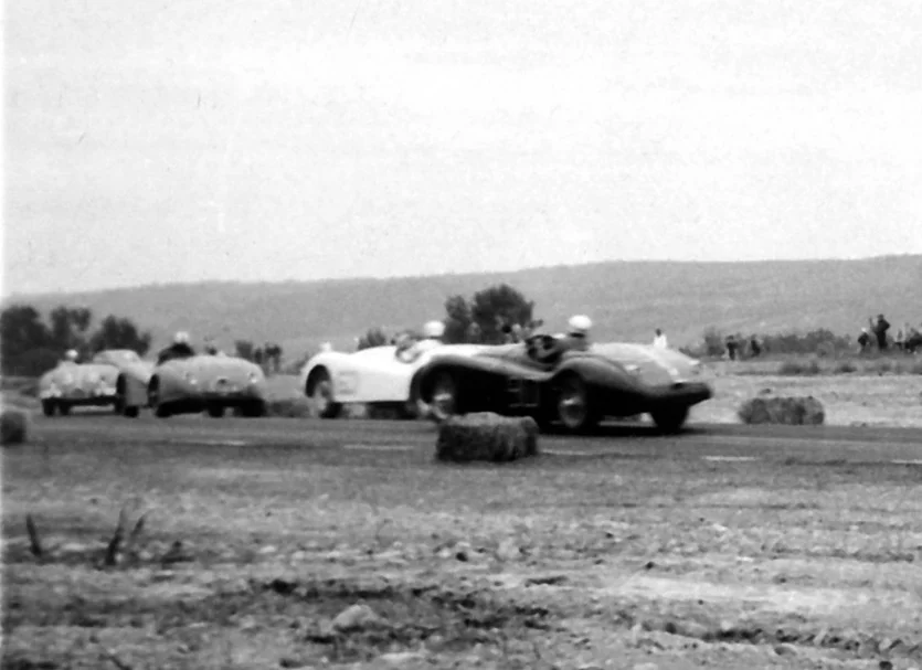 Gordy MacKenzie’s XK-129 follows a group into the chicane. MacKenzie wold finish 13th.
