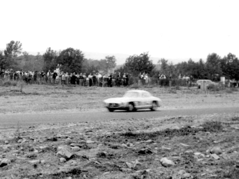 Paul O’Shea finds his way through the construction debris. Spectators in those days were separated from the track by snow fence.