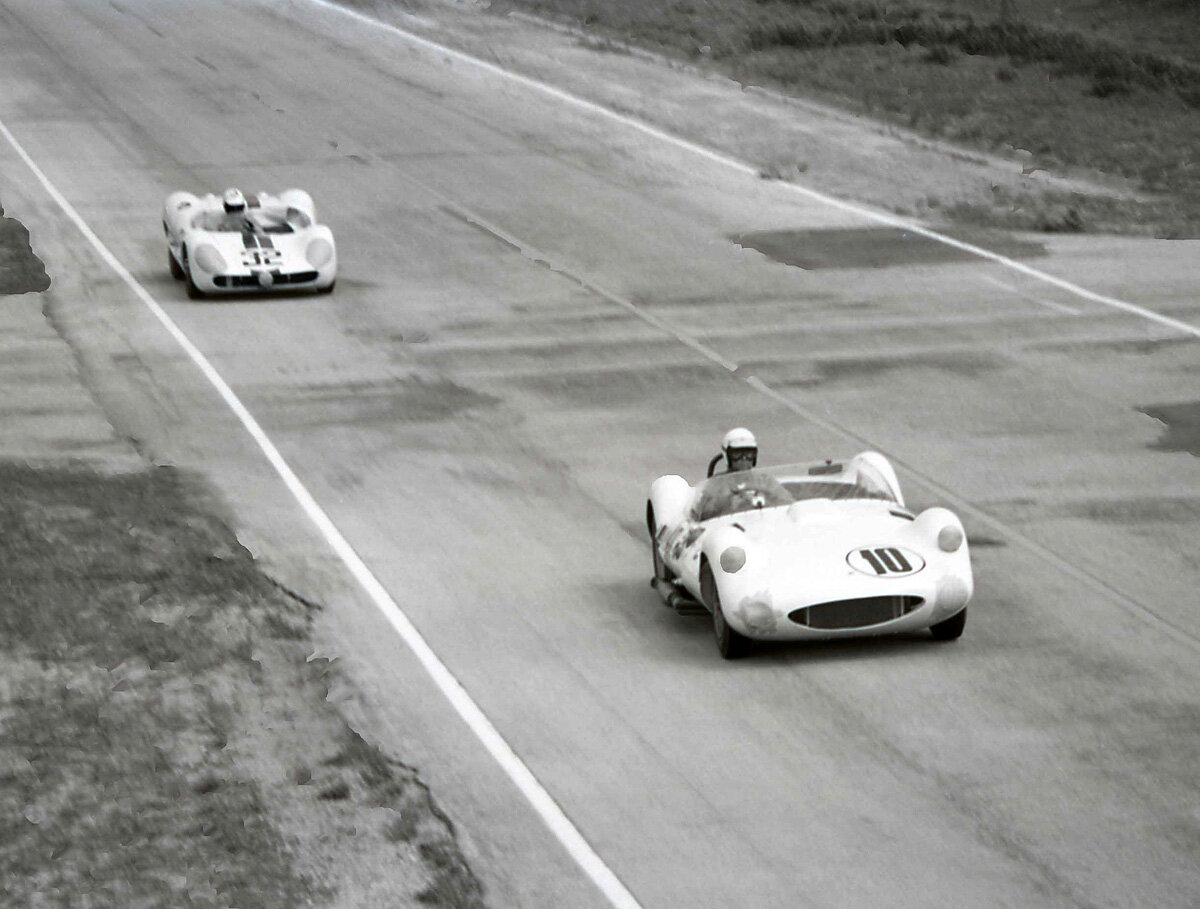 A classic battle early in the day. Chuck Daigh in the Chaparral leads Walt Hansgen in the tipo 64 rear engine Maserati.