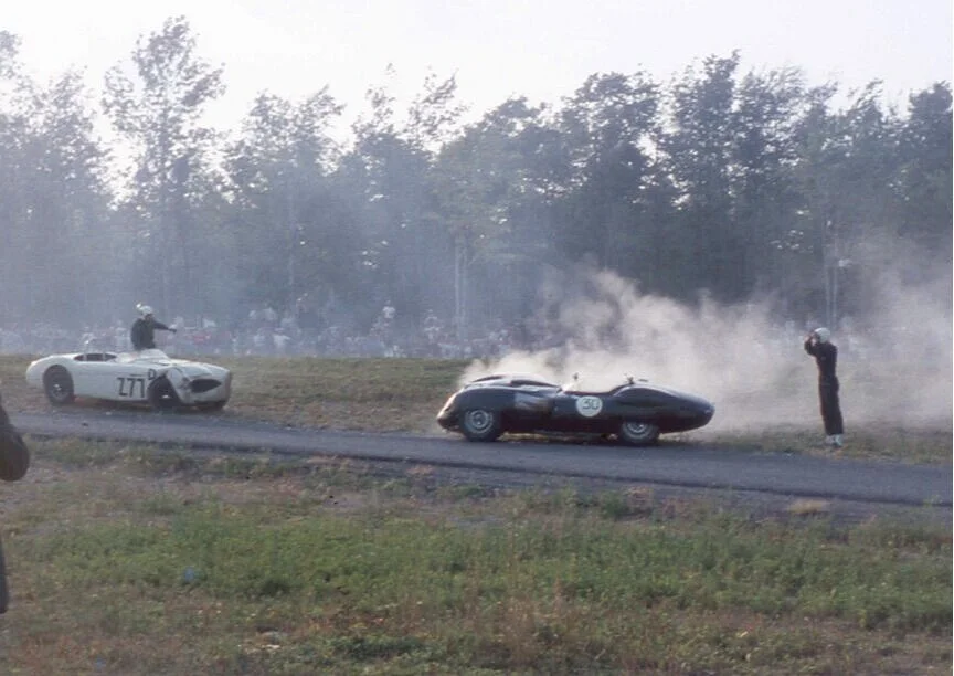 Flyod Aaskov holds his head looking at his smashed Costin Lister Buick. Aaskov and Grant Clark collided coming into the last turn and ended up just off the pit entrance road.