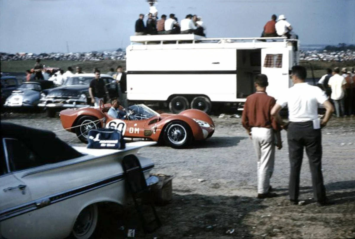 Spectators get a good, close up look at the fastest car of the weekend, the Tipo 61 Maserati or Walt Hansgen.