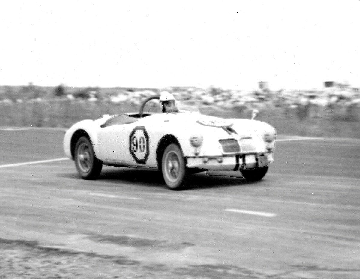 BARC driver Ted Rounds takes the ex factory car past the start finish line. Note on the LF the NY State license plate. Watkins Glen was only 60 miles from Binghamton and Ted drove the car to the races and back.