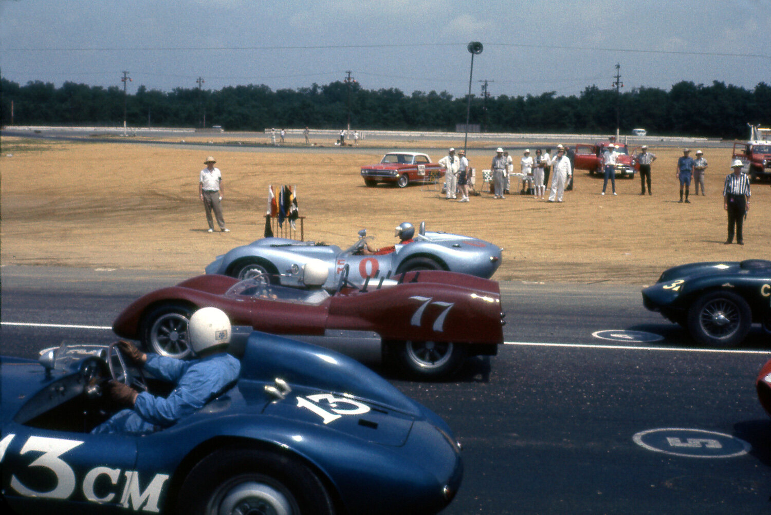 This shot is from the June 30, 1963 race meet. Harold Keck is on pole in the blue Lister Chev with Bill Wonder’s Genie next to him and Jack Stewarts Demar.